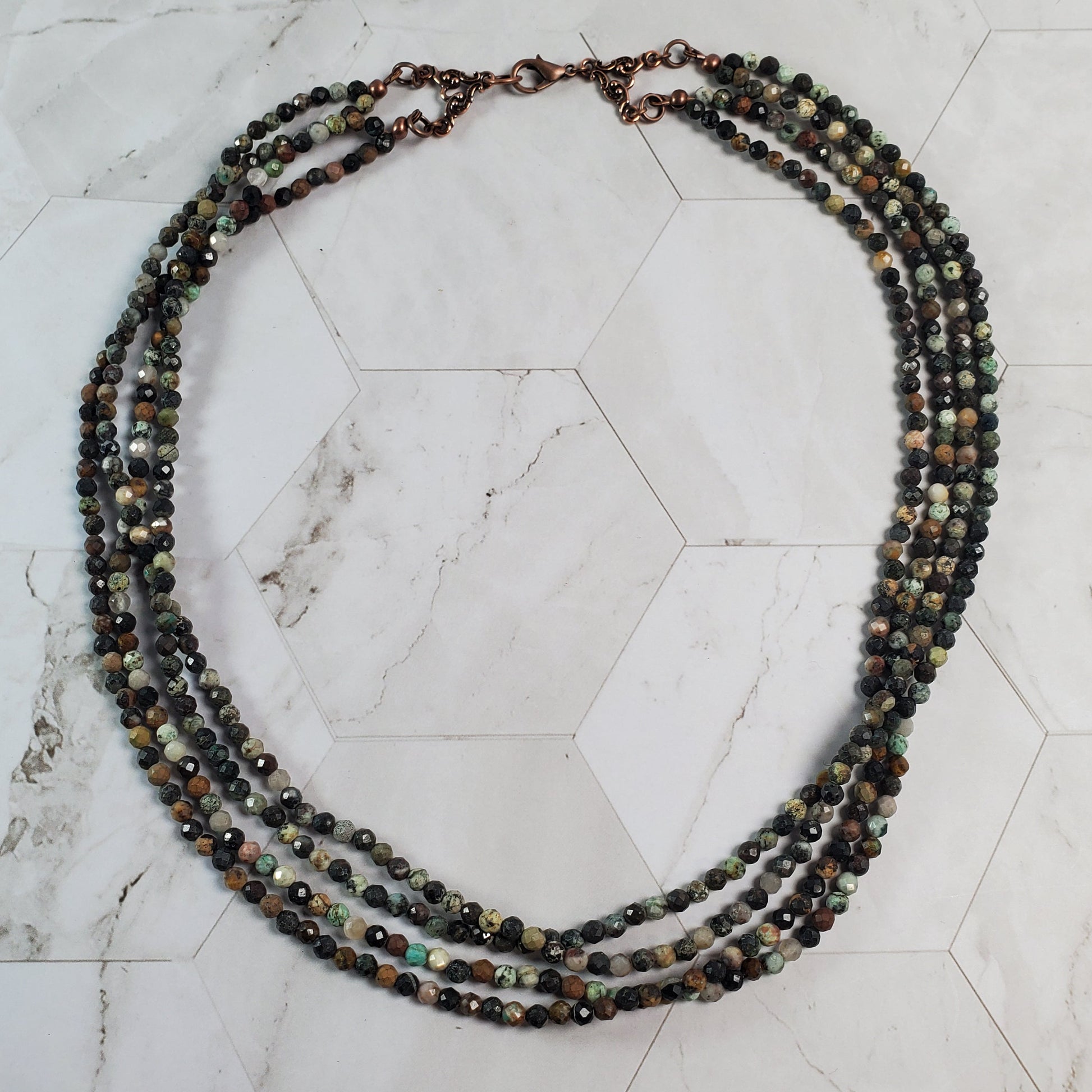 Beaded necklace on a marble surface