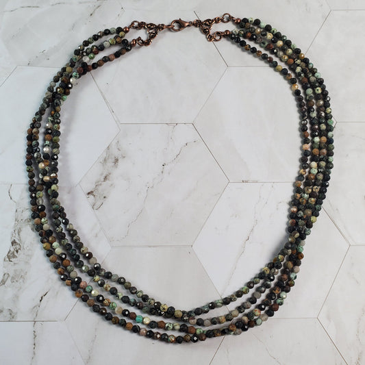Beaded necklace on a marble surface