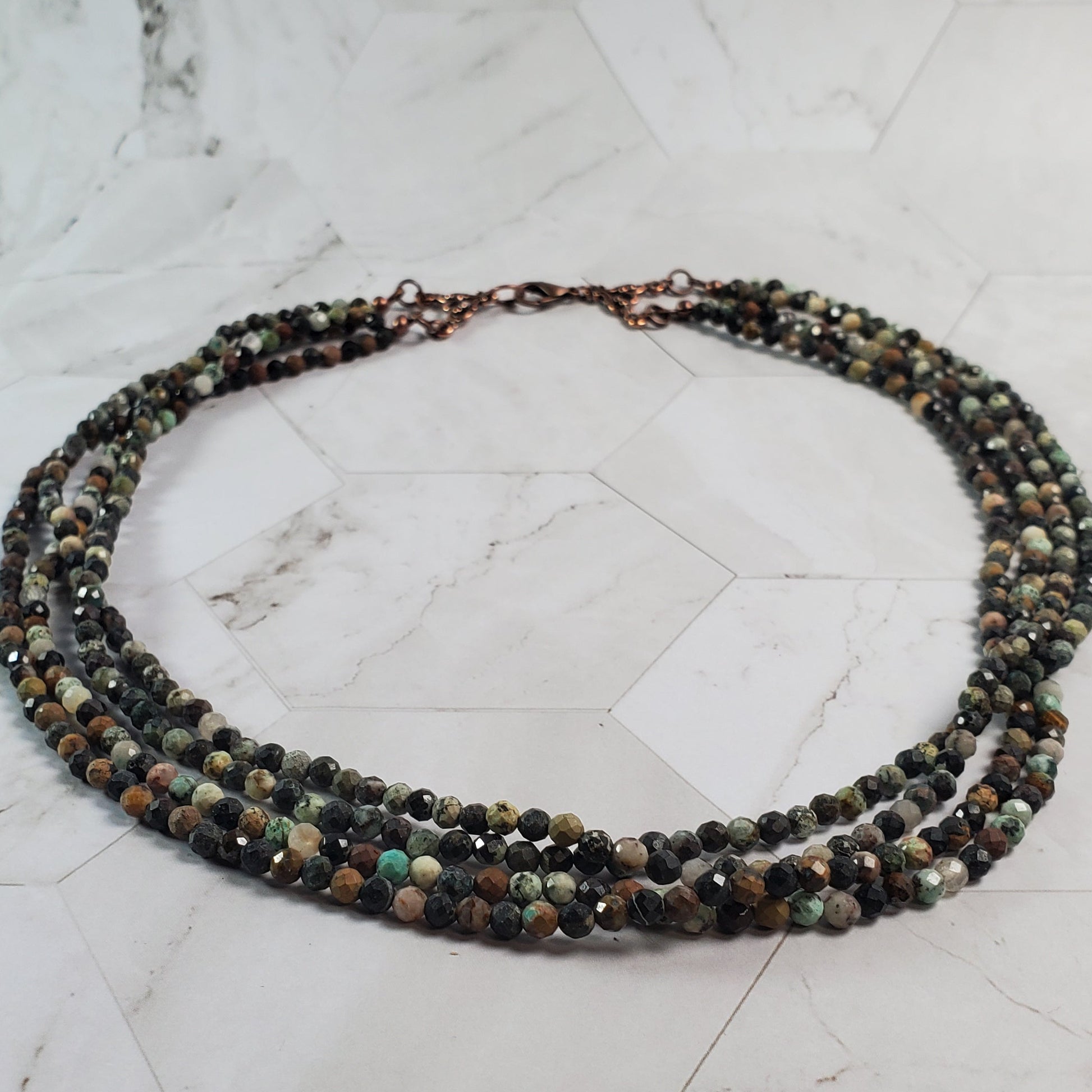 Beaded necklace on a marble surface