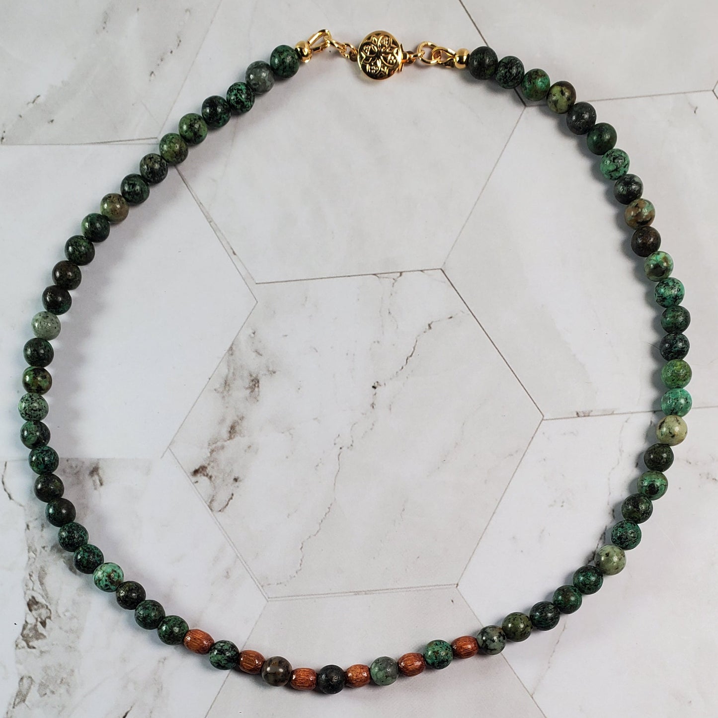 Beaded necklace on a marble surface