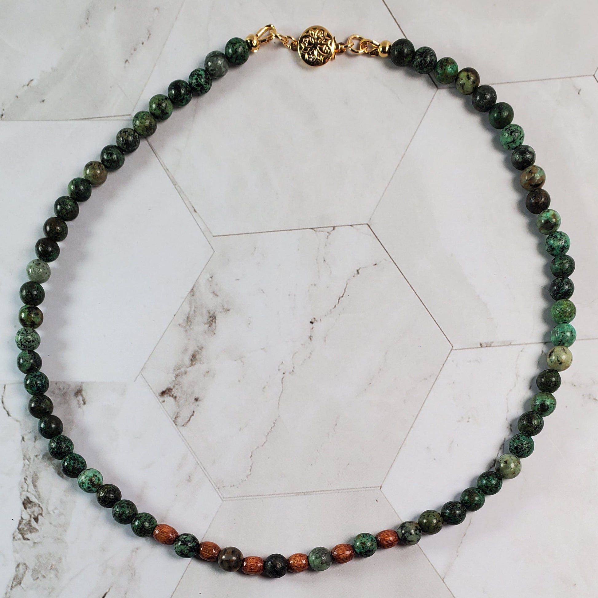 Beaded necklace on a marble surface