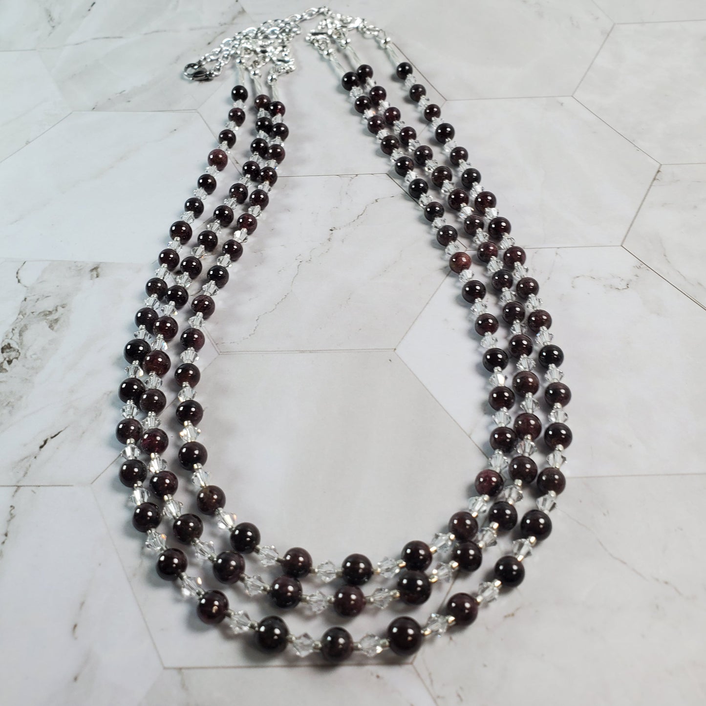Beaded necklace on a marble surface