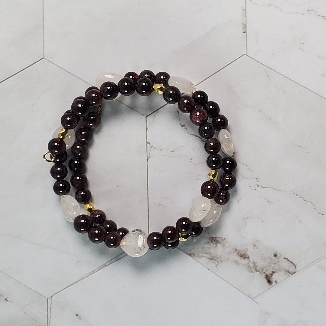 Beaded bracelet on a marble-patterned surface