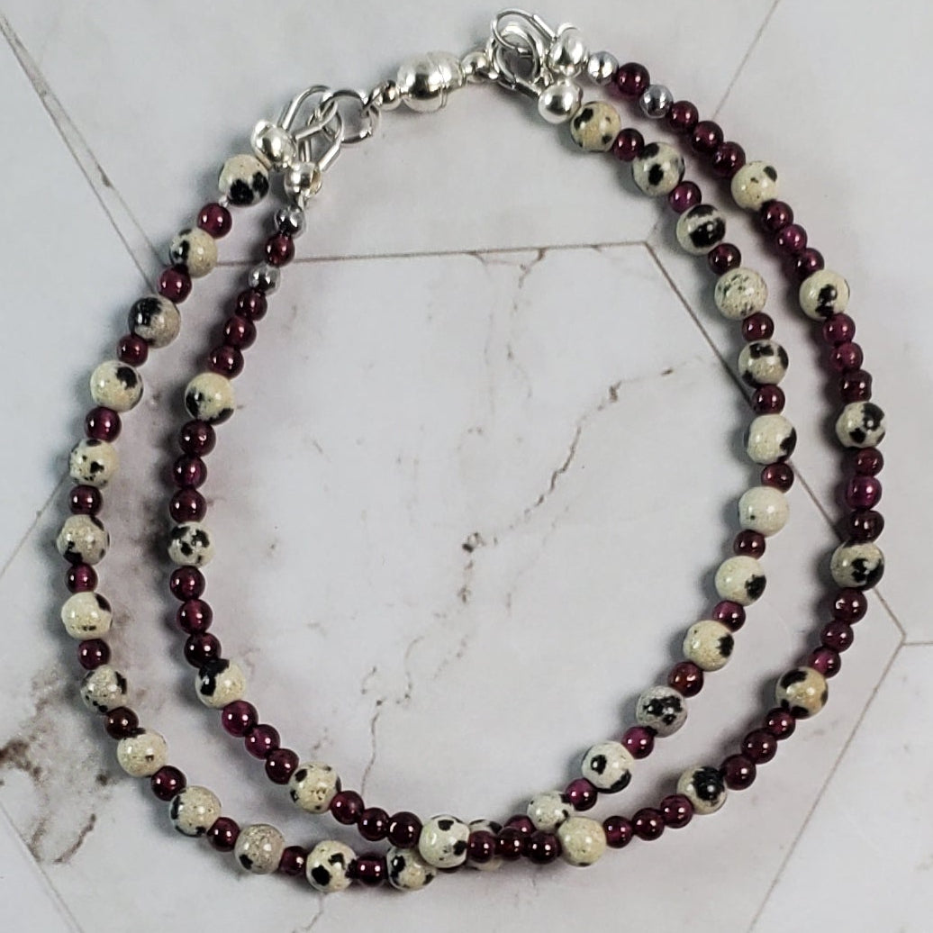 Two strand beaded bracelet on a marble floor