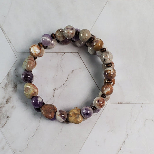 Multicolored beaded bracelet on a marble surface