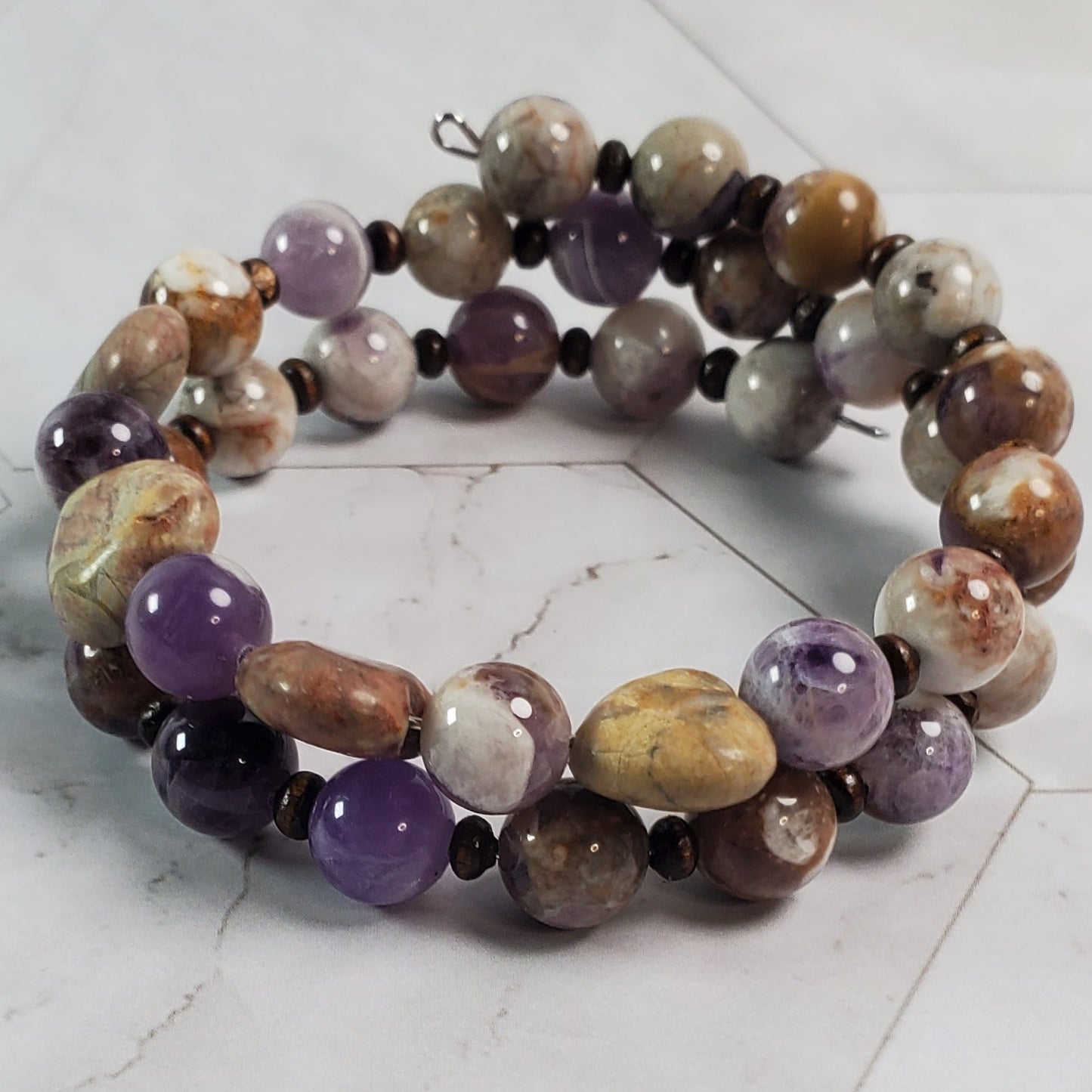 Multicolored beaded bracelet on a marble surface