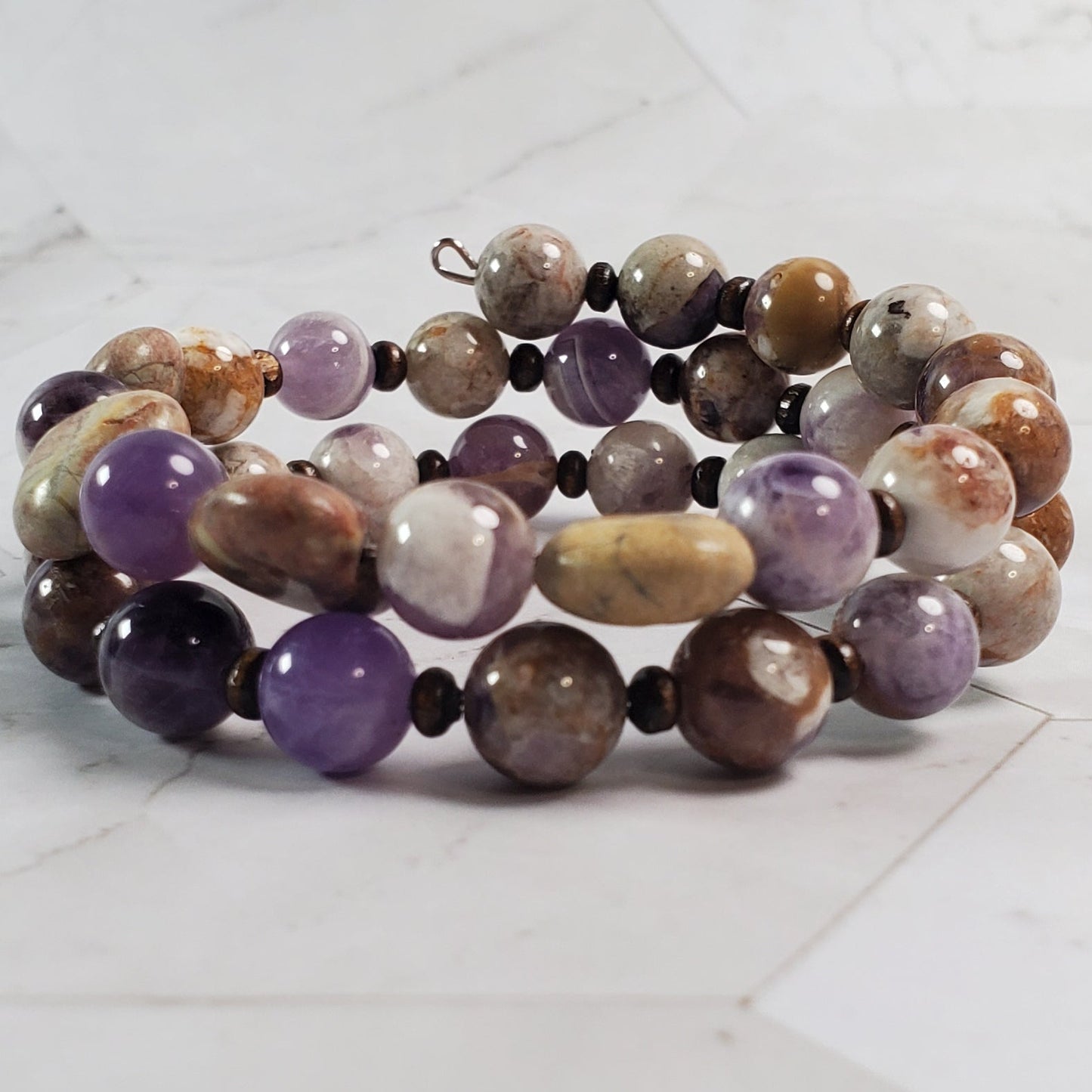 Multicolored beaded bracelet on a marble surface