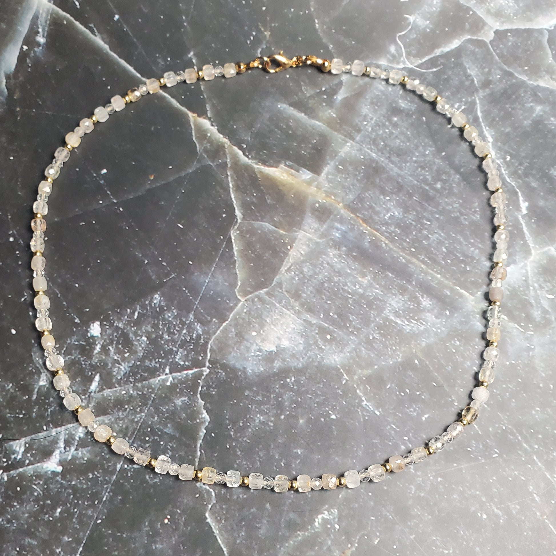 Topaz beaded bracelet on a dark marble surface