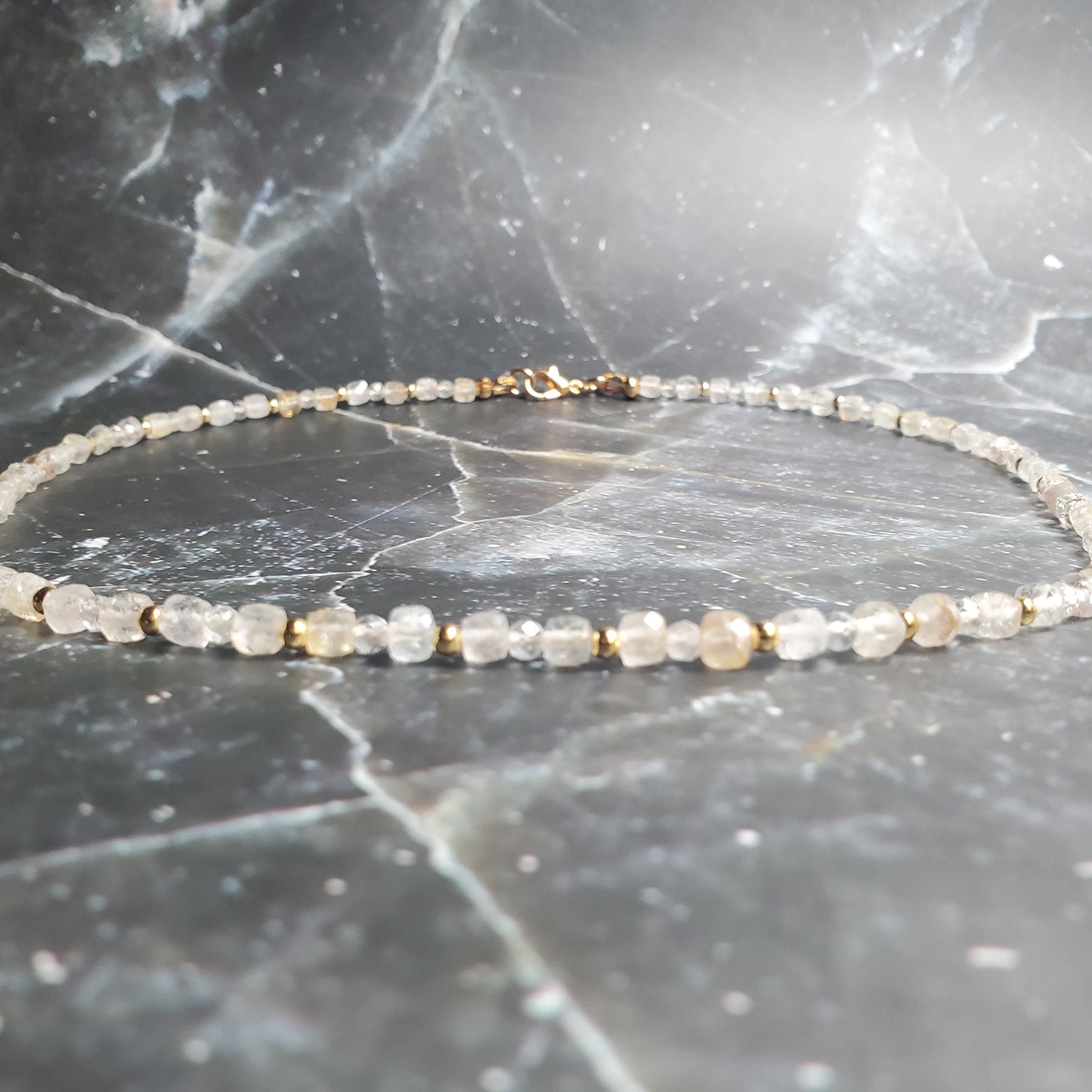 Delicate beaded bracelet on a marble surface