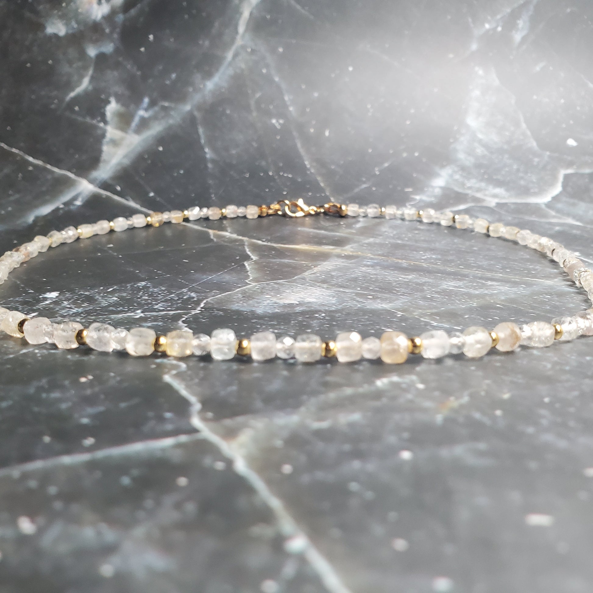 Delicate beaded bracelet on a marble surface