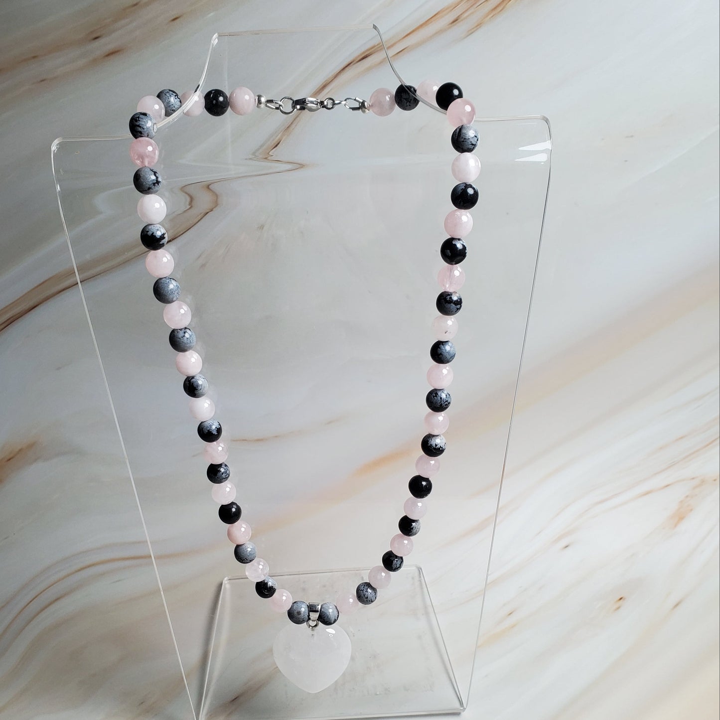 Beaded necklace on a marble surface