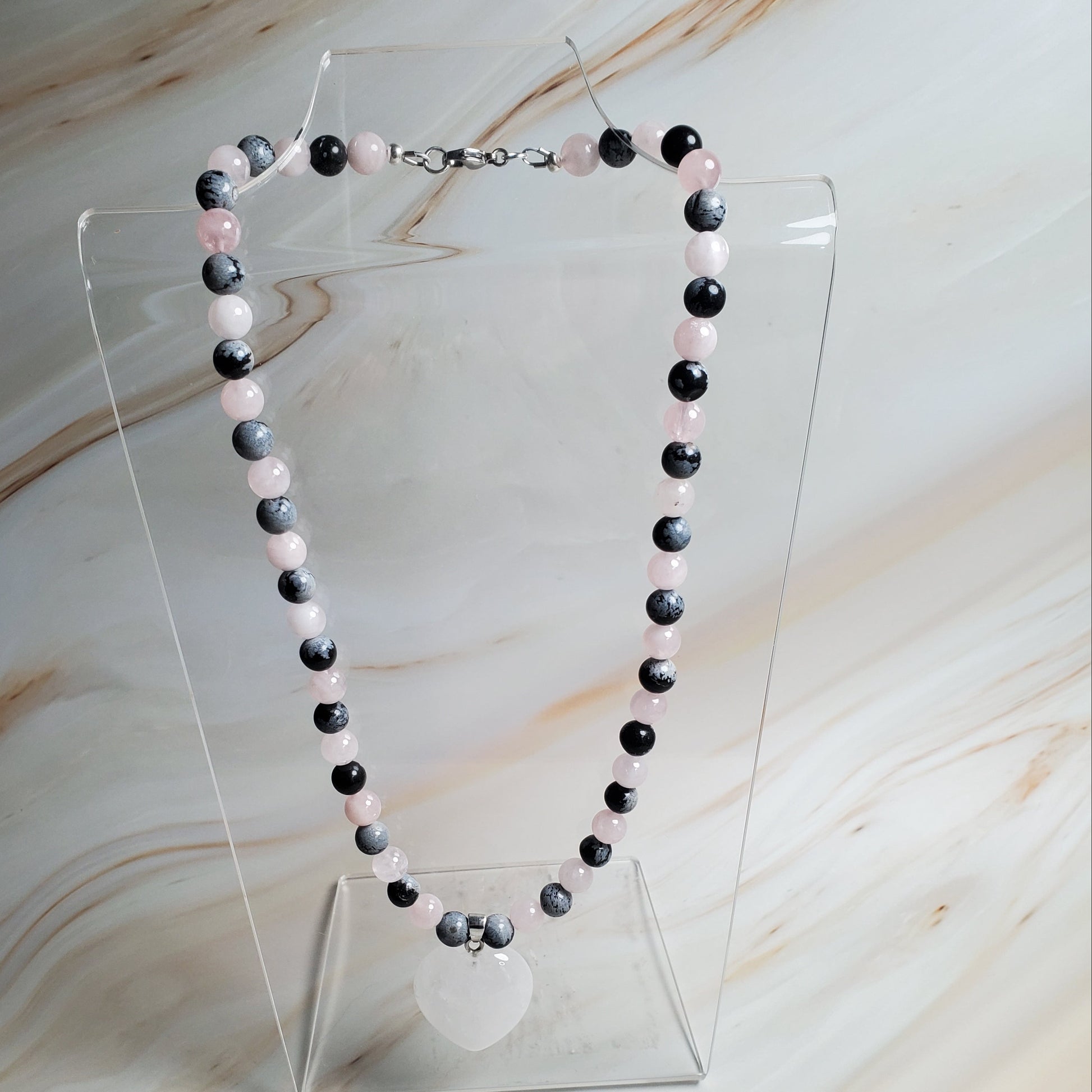Beaded necklace on a marble surface