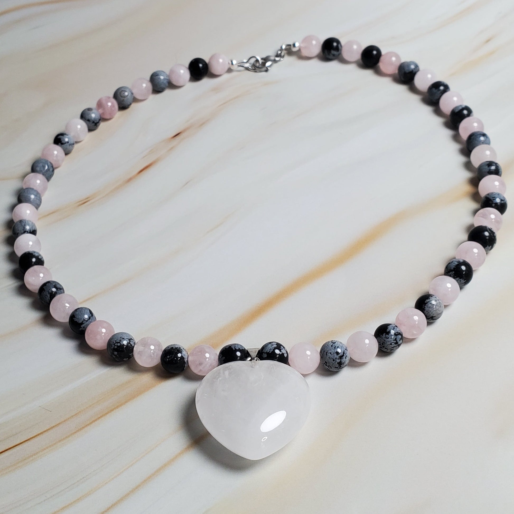 Necklace with beads on a marble surface