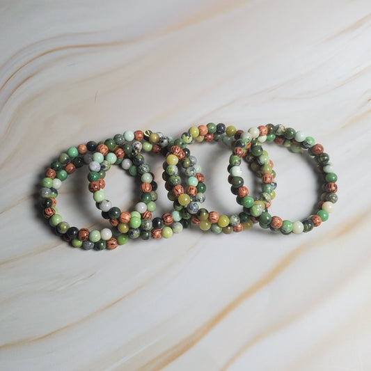 Set of beaded bracelets on a marble surface