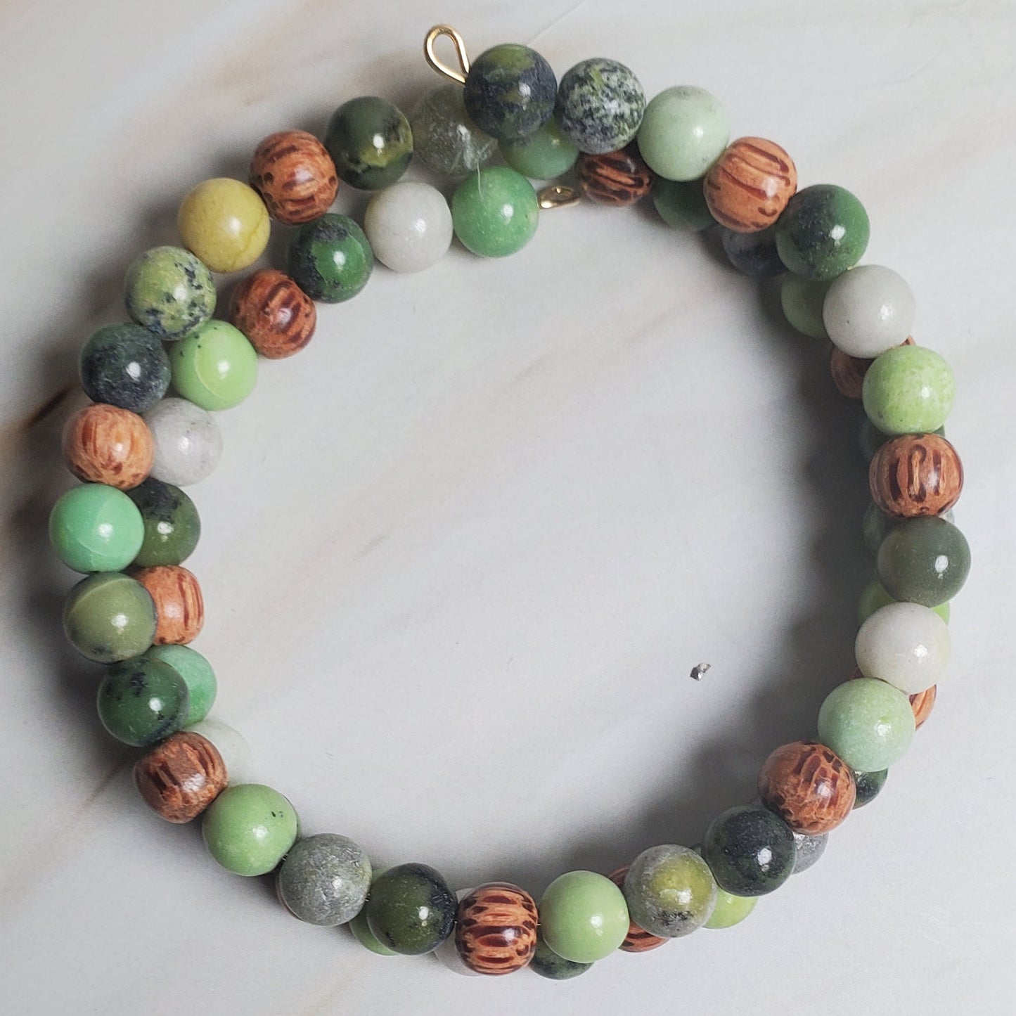 Multicolored beaded bracelet on a marble surface
