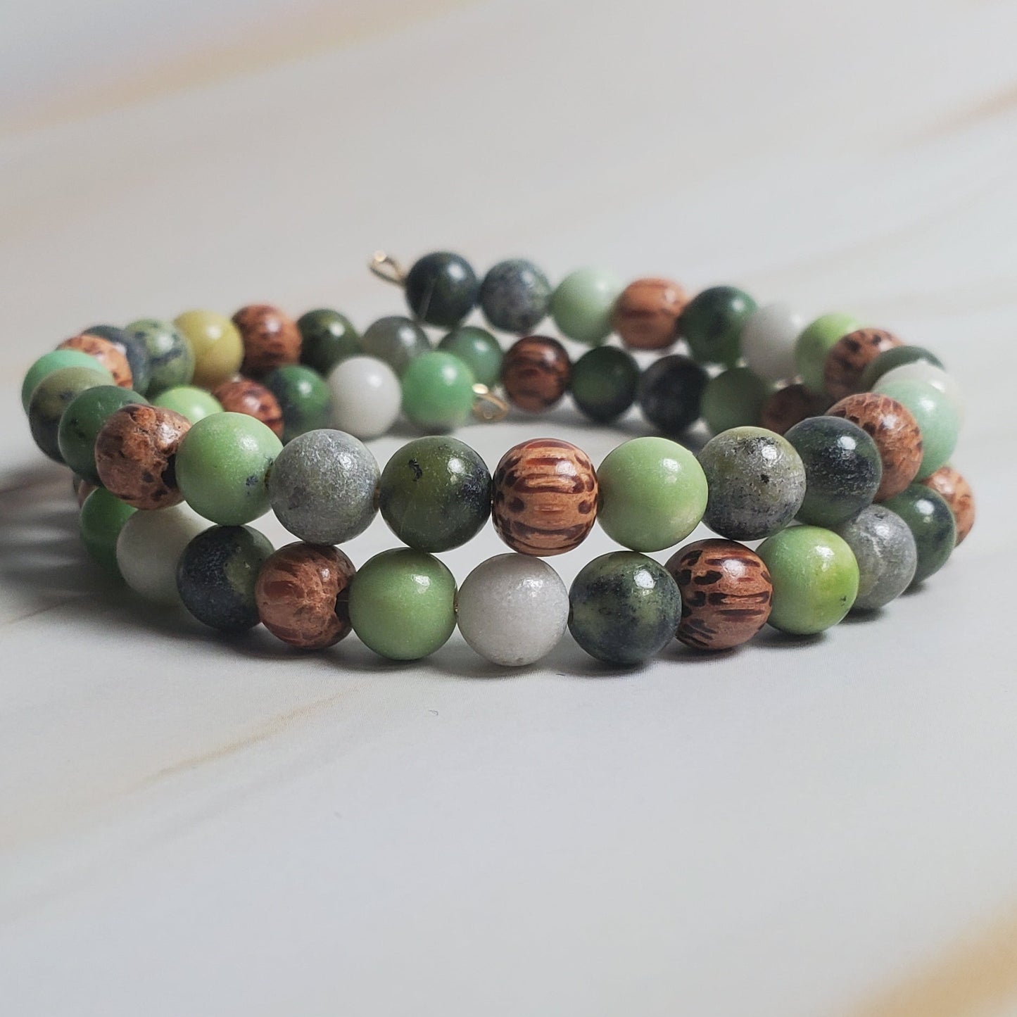 Beaded bracelet on a light wooden surface