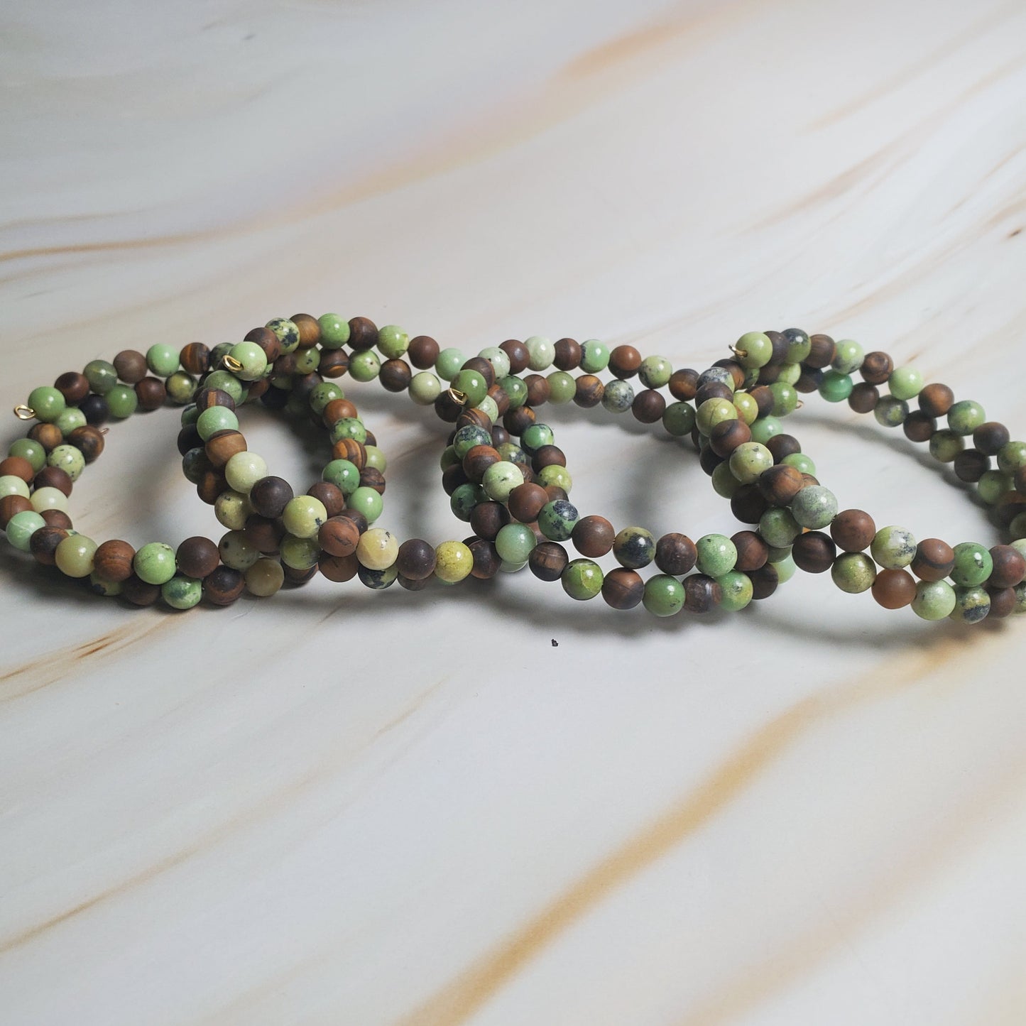 Beaded bracelets on a marble surface