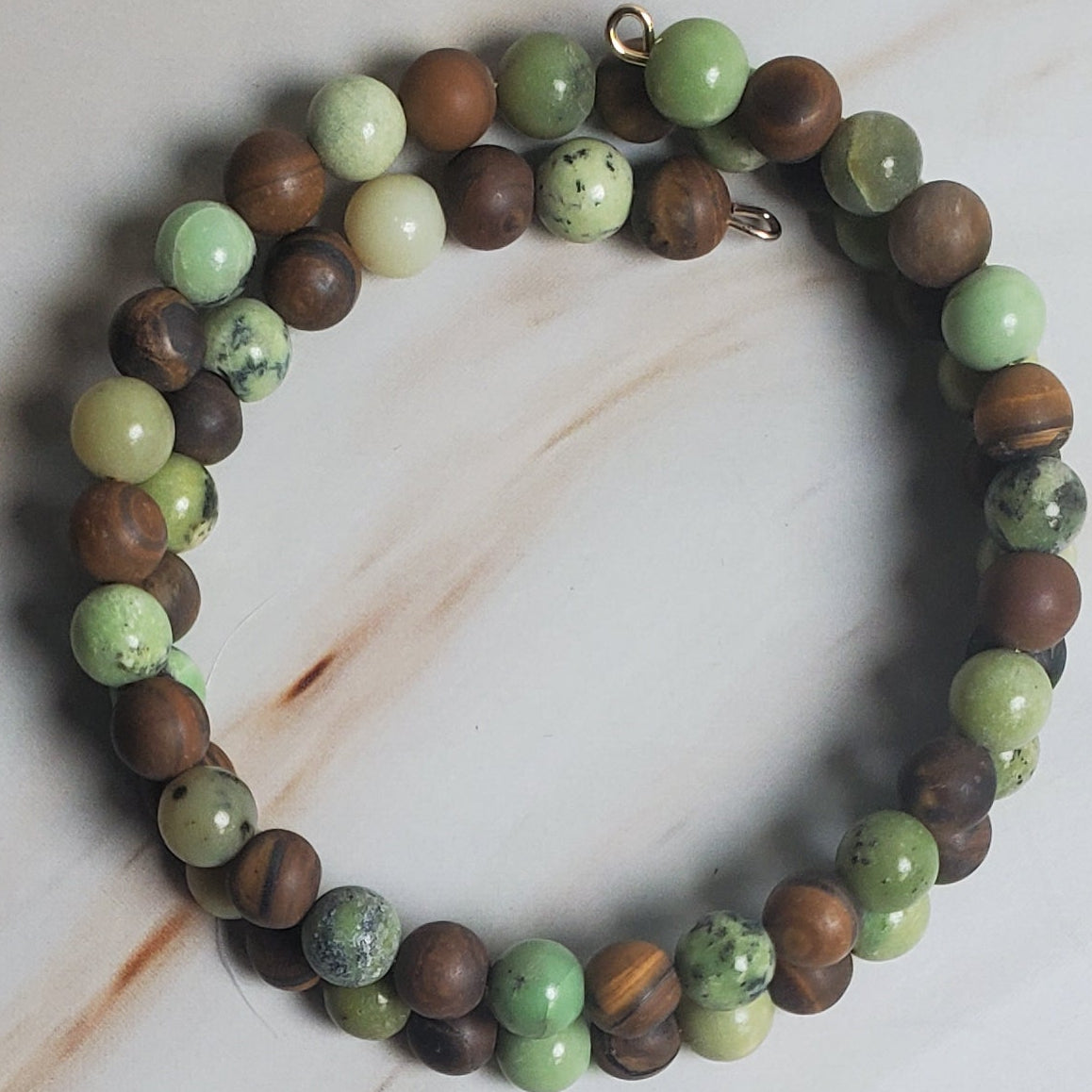 Beaded bracelet on a light wooden surface