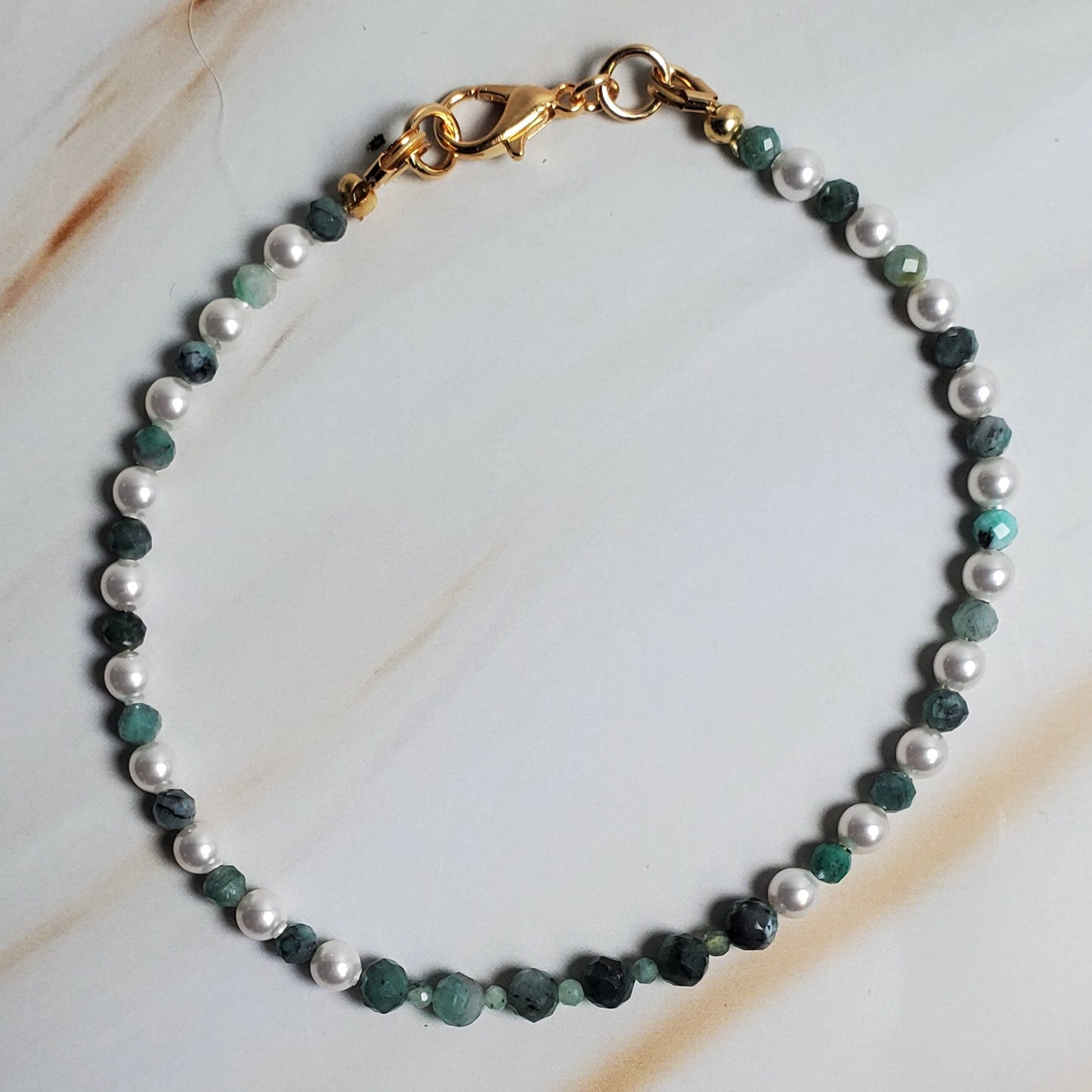 Beaded bracelet on a marble surface