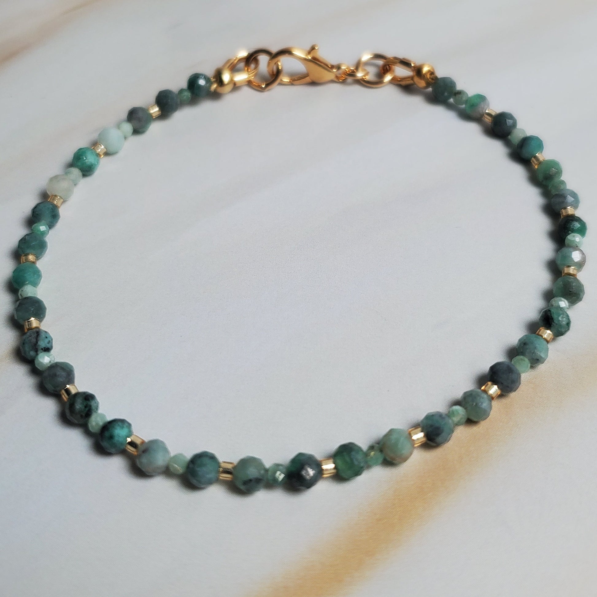 Beaded bracelet on a white fabric background