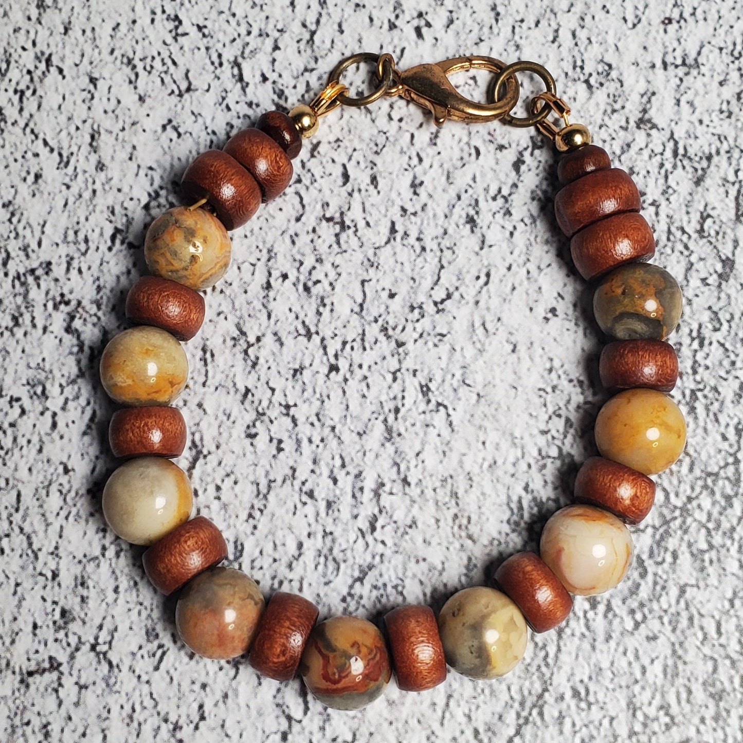 Beaded bracelet on a textured gray surface