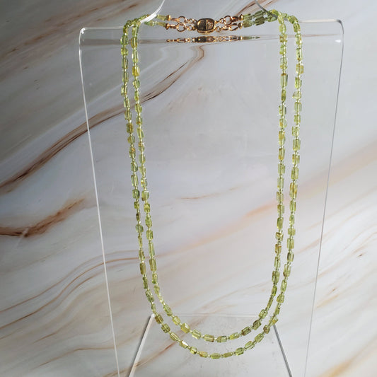 Double-strand peridot chip gemstone necklace with gold-tone clasp in vibrant green