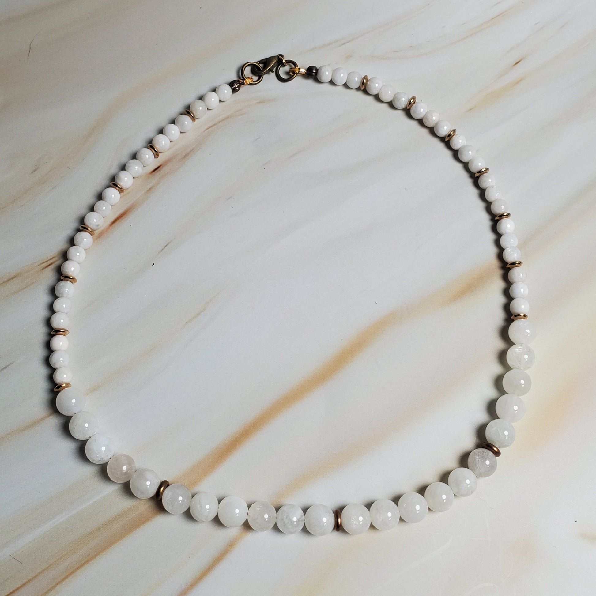 Moonstone necklace on a marble surface