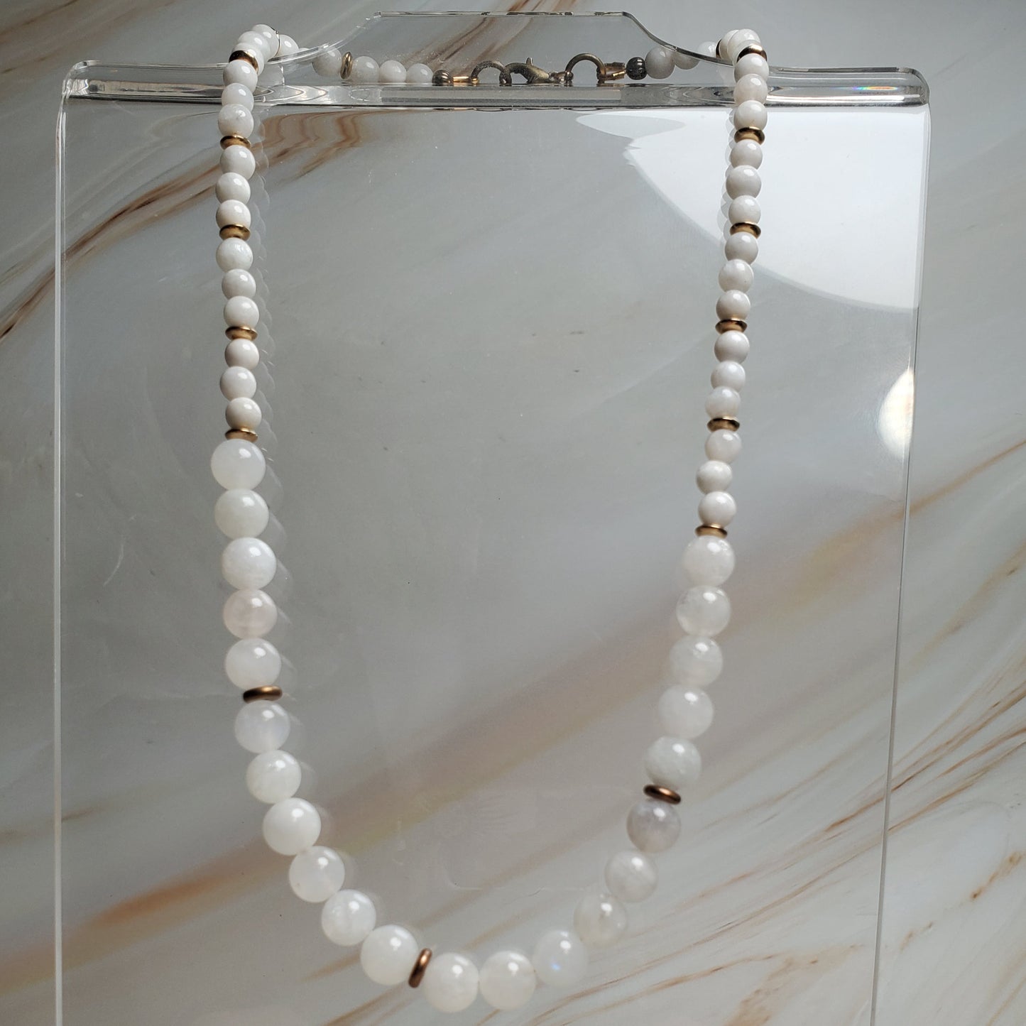 Moonstone necklace on a marble surface