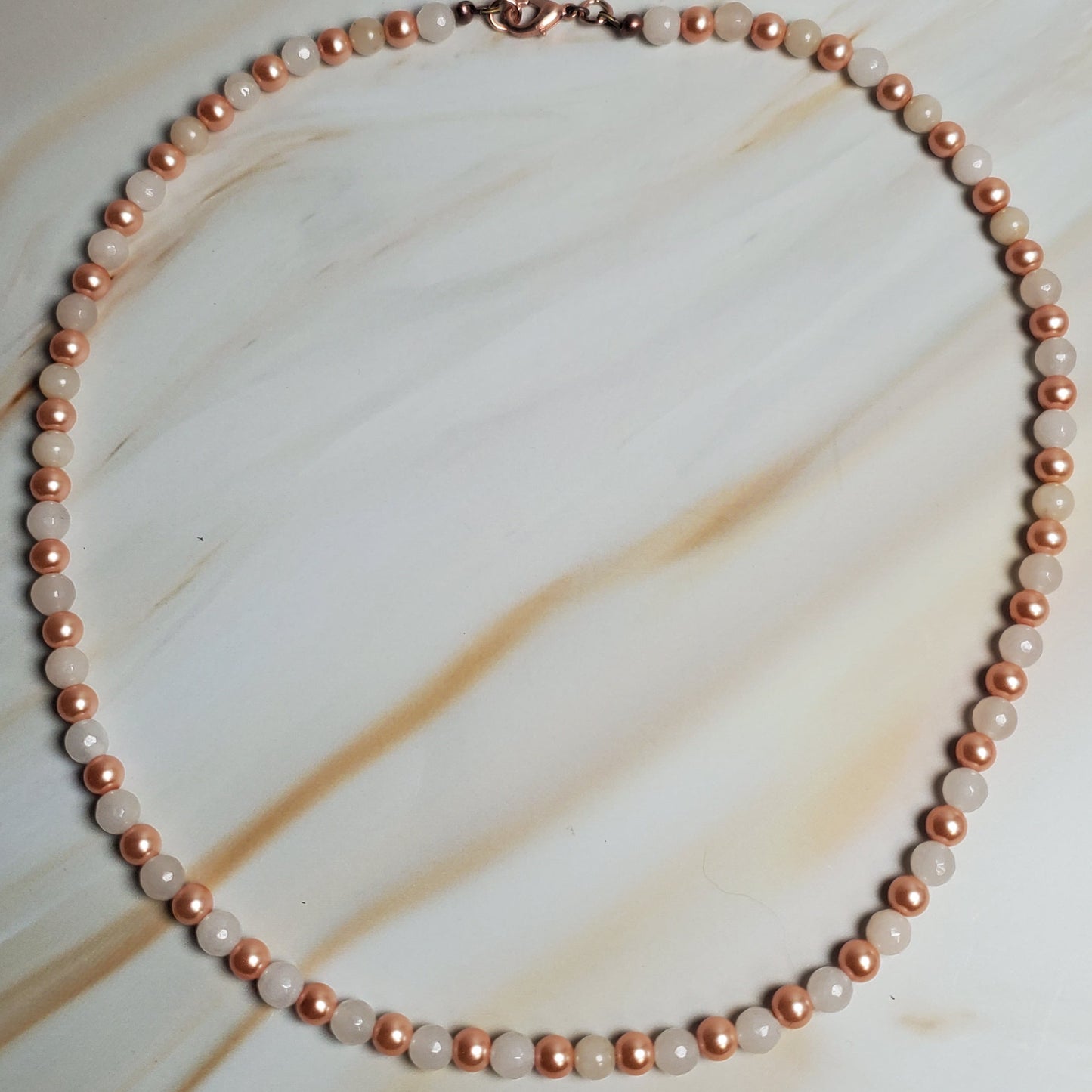 Pearl necklace on a marble surface
