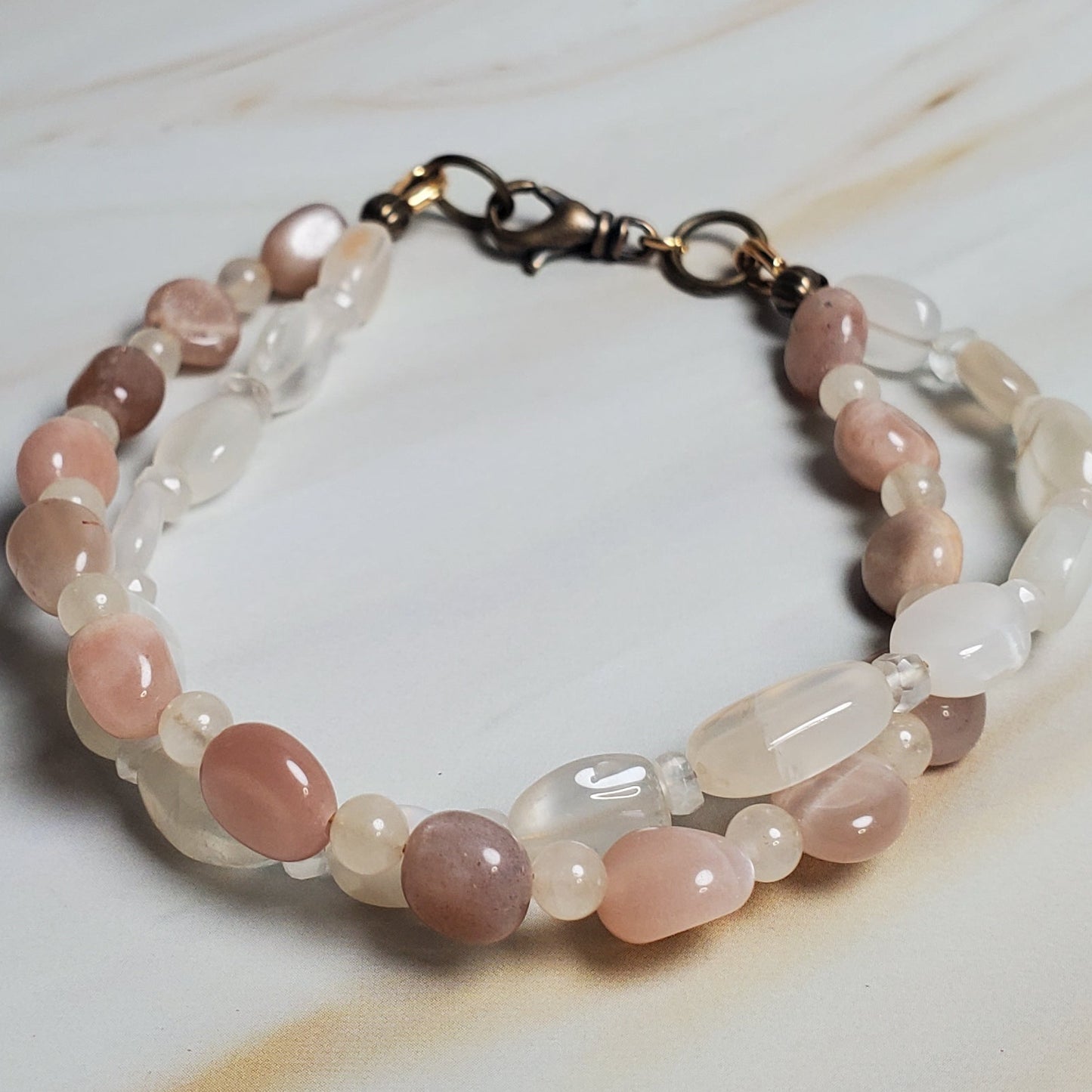 Stacked beaded bracelet on a textured surface
