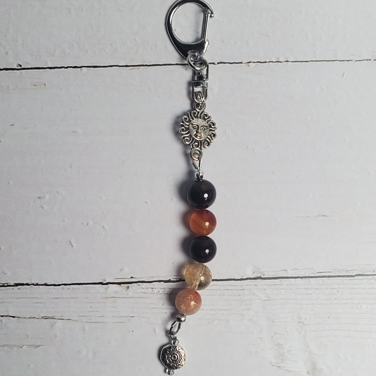 Beaded keychain on a white wooden surface