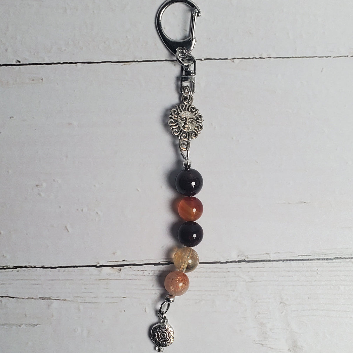 Beaded keychain on a white wooden surface