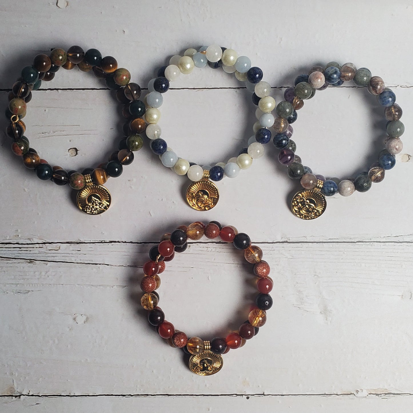 Set of beaded bracelets on a rustic wooden surface