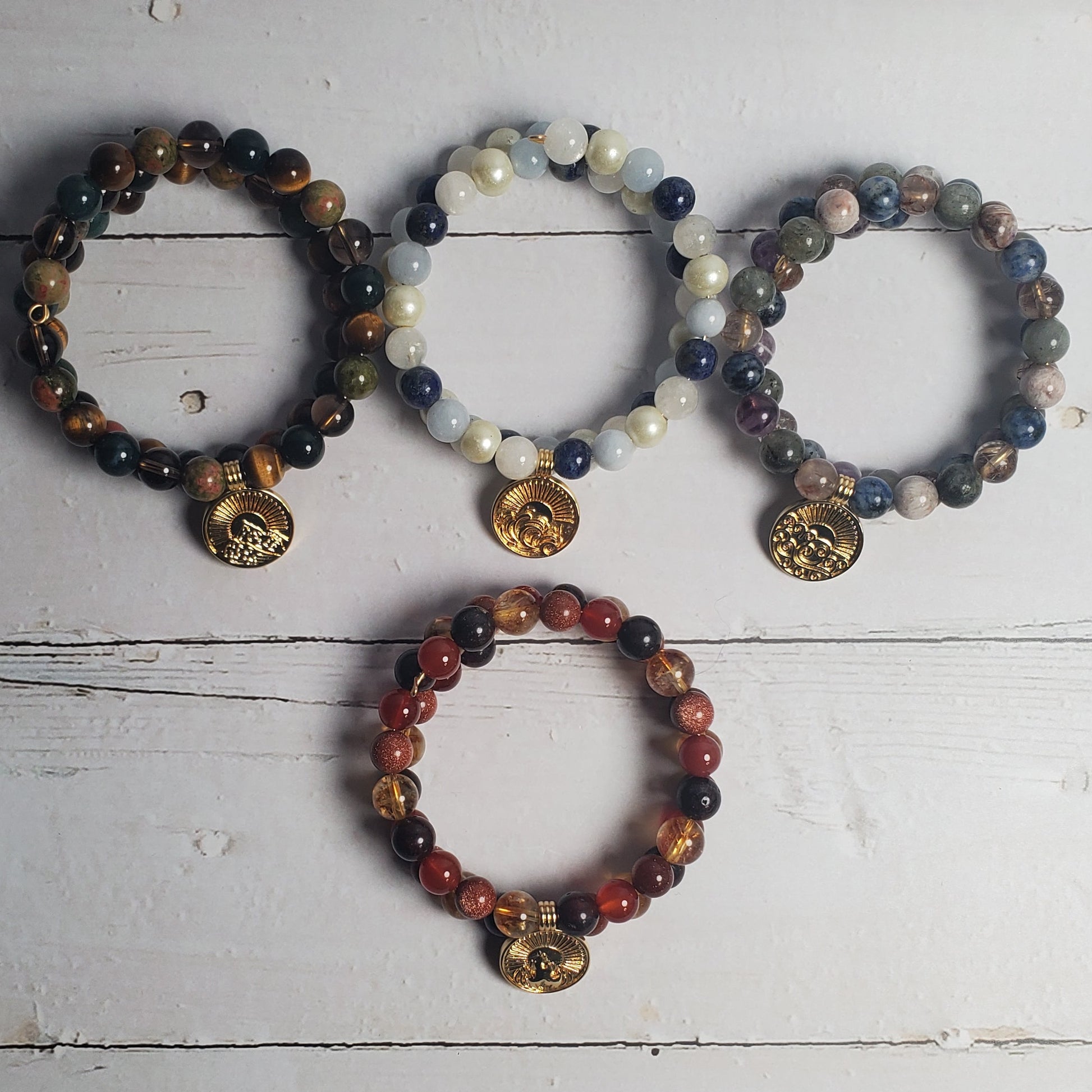 Set of beaded bracelets on a rustic wooden surface