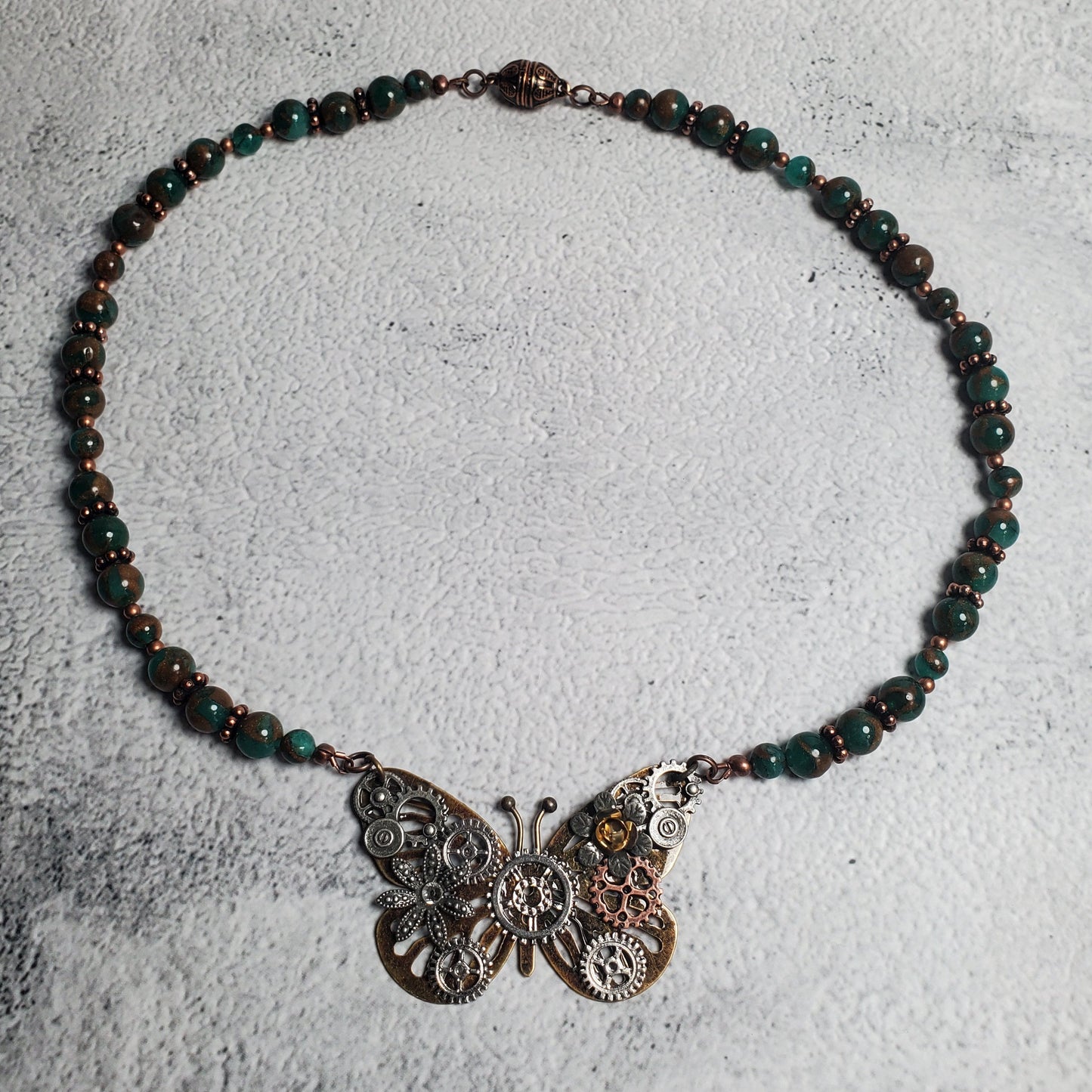 Industrial style necklace with copper mechanical butterfly pendant and green resin sponge quartz beads