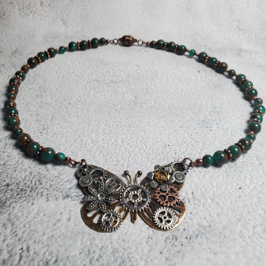 Industrial style necklace with mechanical butterfly pendant and green resin sponge quartz beads