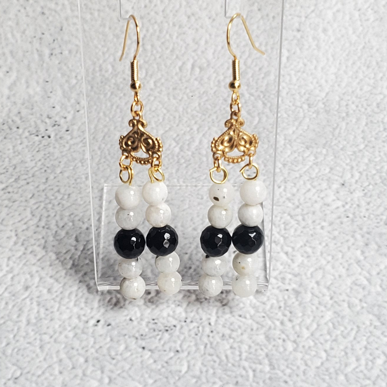 Elegant gemstone earrings with white Moonstone and black Onyx chandelier design