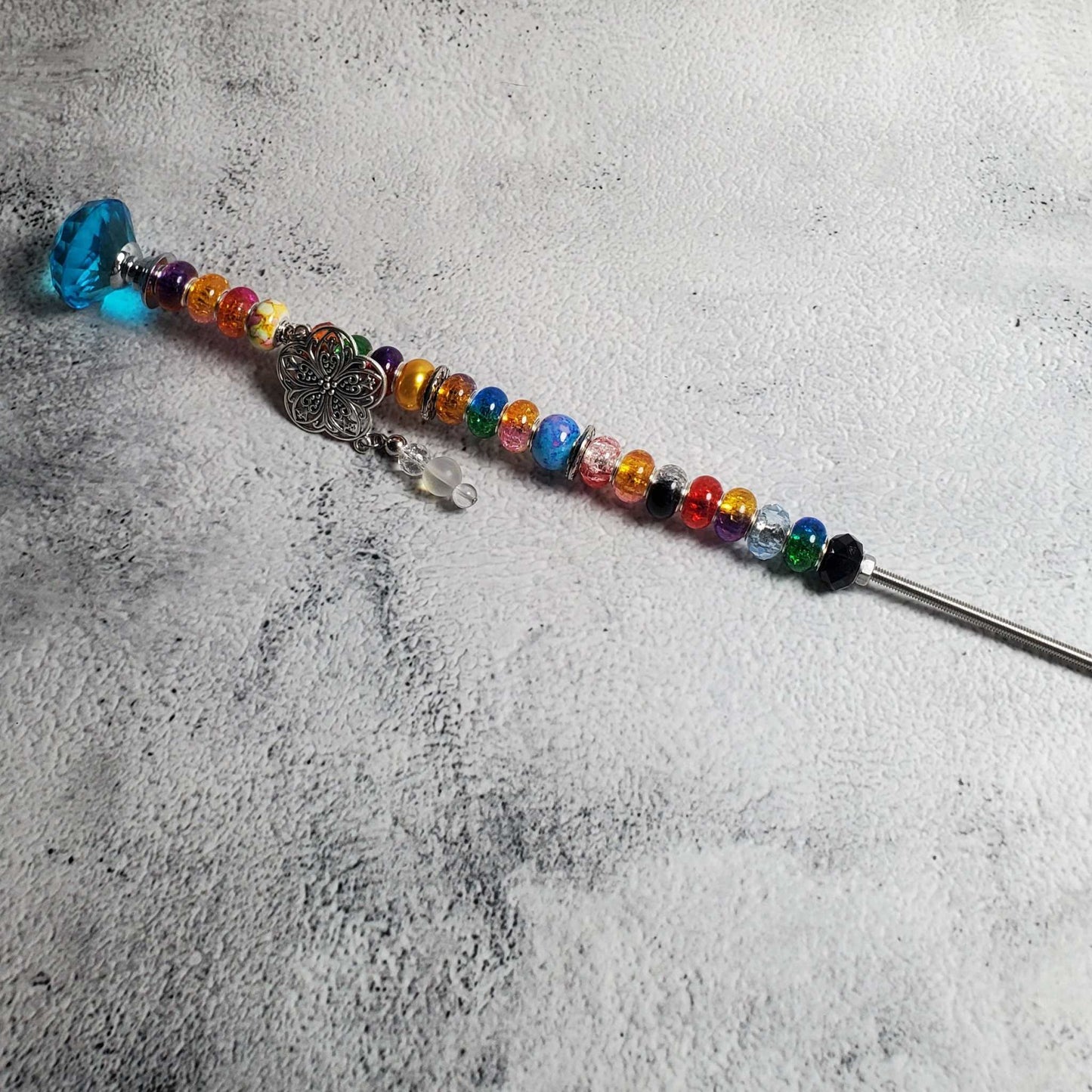 Handcrafted Fairy Wand garden accent with floral details, vibrant beads, and crystal knob