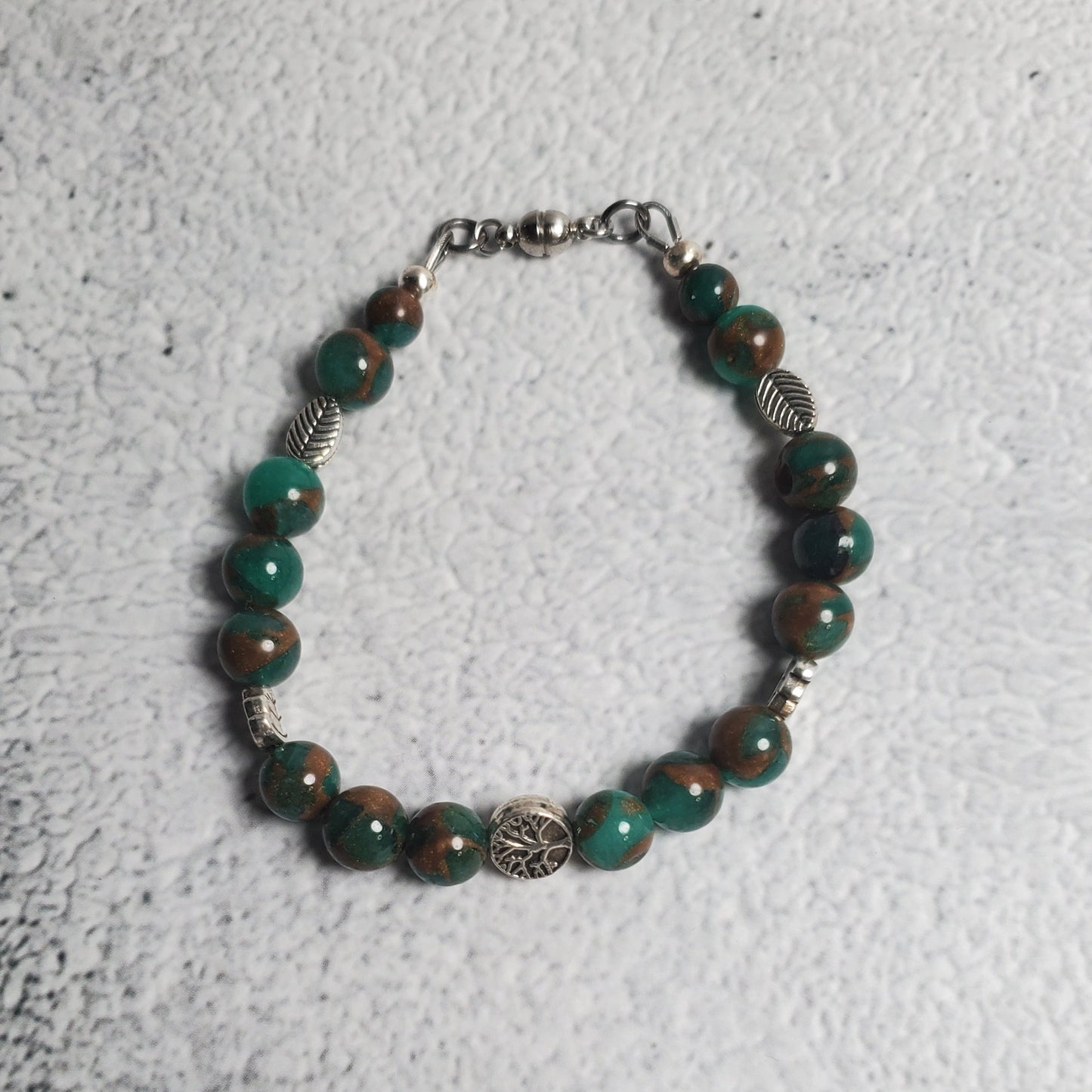 Handcrafted gemstone bracelet featuring green resin sponge quartz and Tree of Life pewter beads with Celtic design