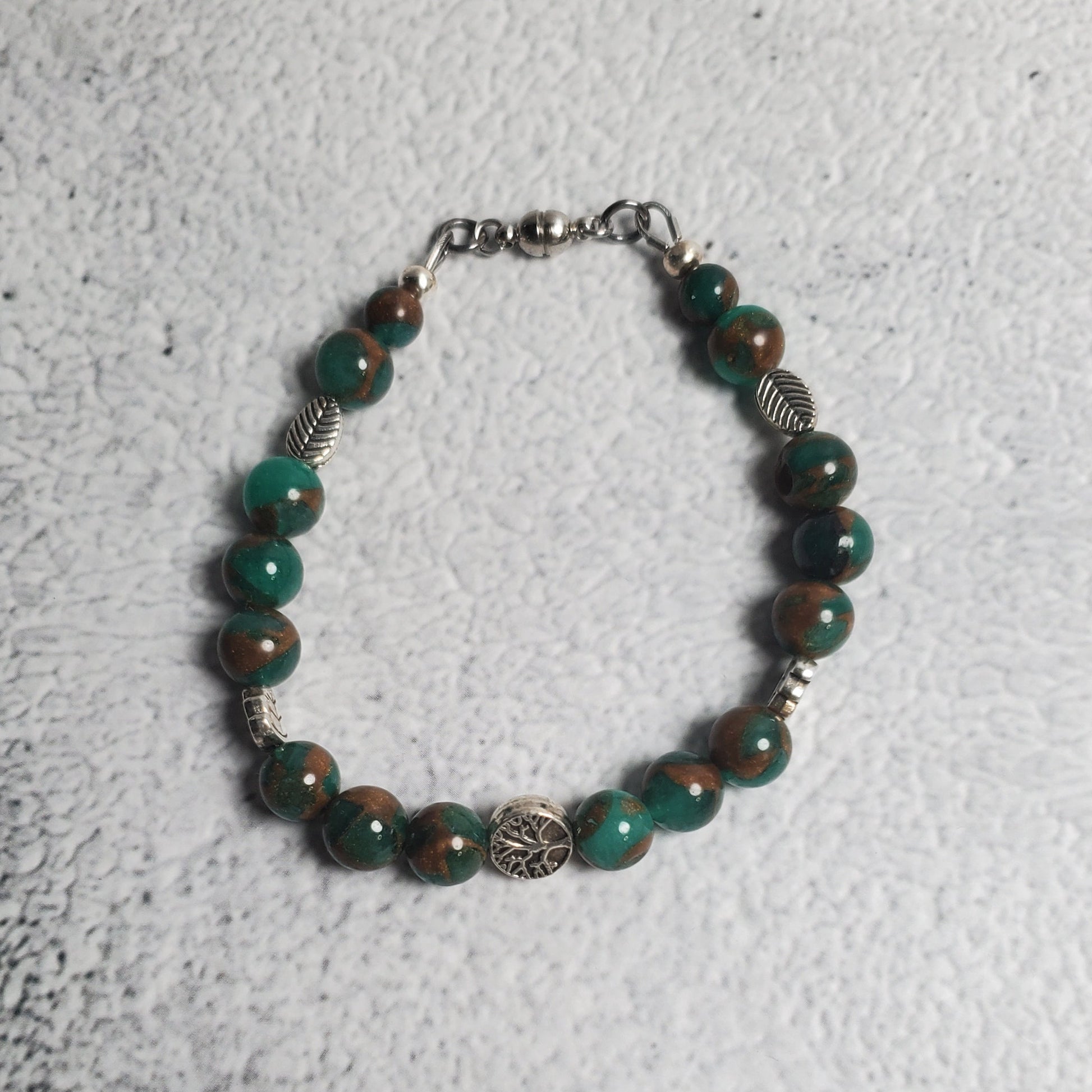 Handcrafted gemstone bracelet featuring green resin sponge quartz and Tree of Life pewter beads with Celtic design