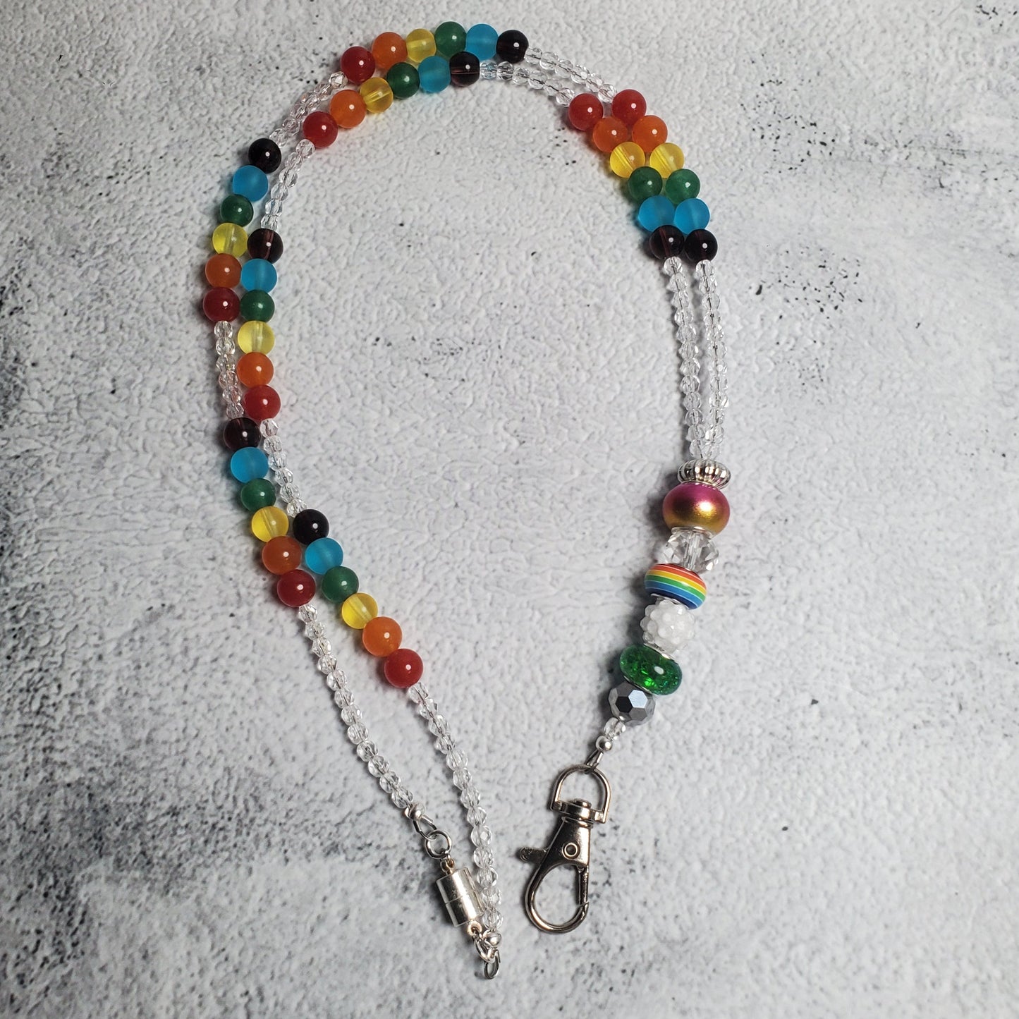 Colorful rainbow lanyard with glass beads and European charm beads for Pride and inclusion