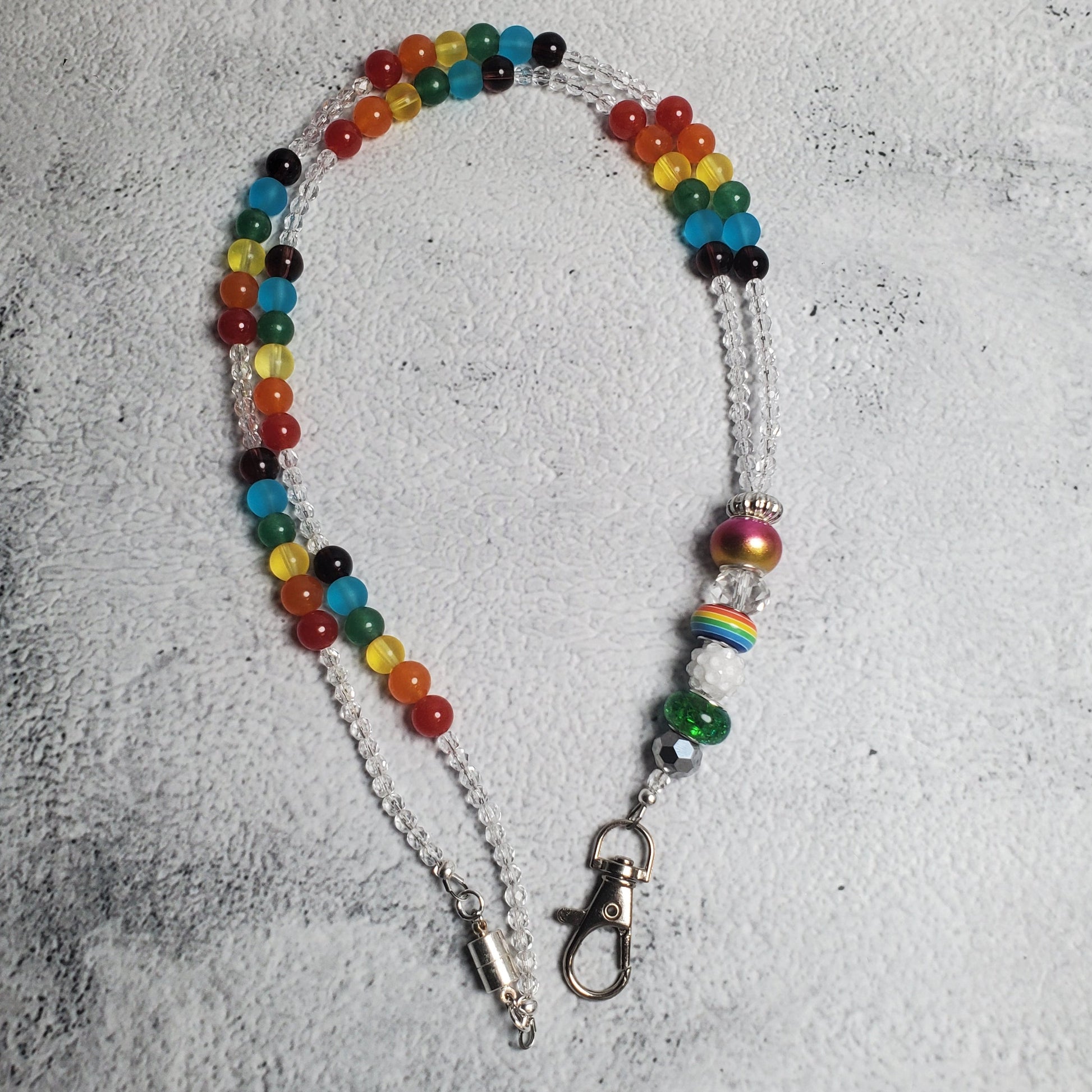 Colorful rainbow lanyard with glass beads and European charm beads for Pride and inclusion