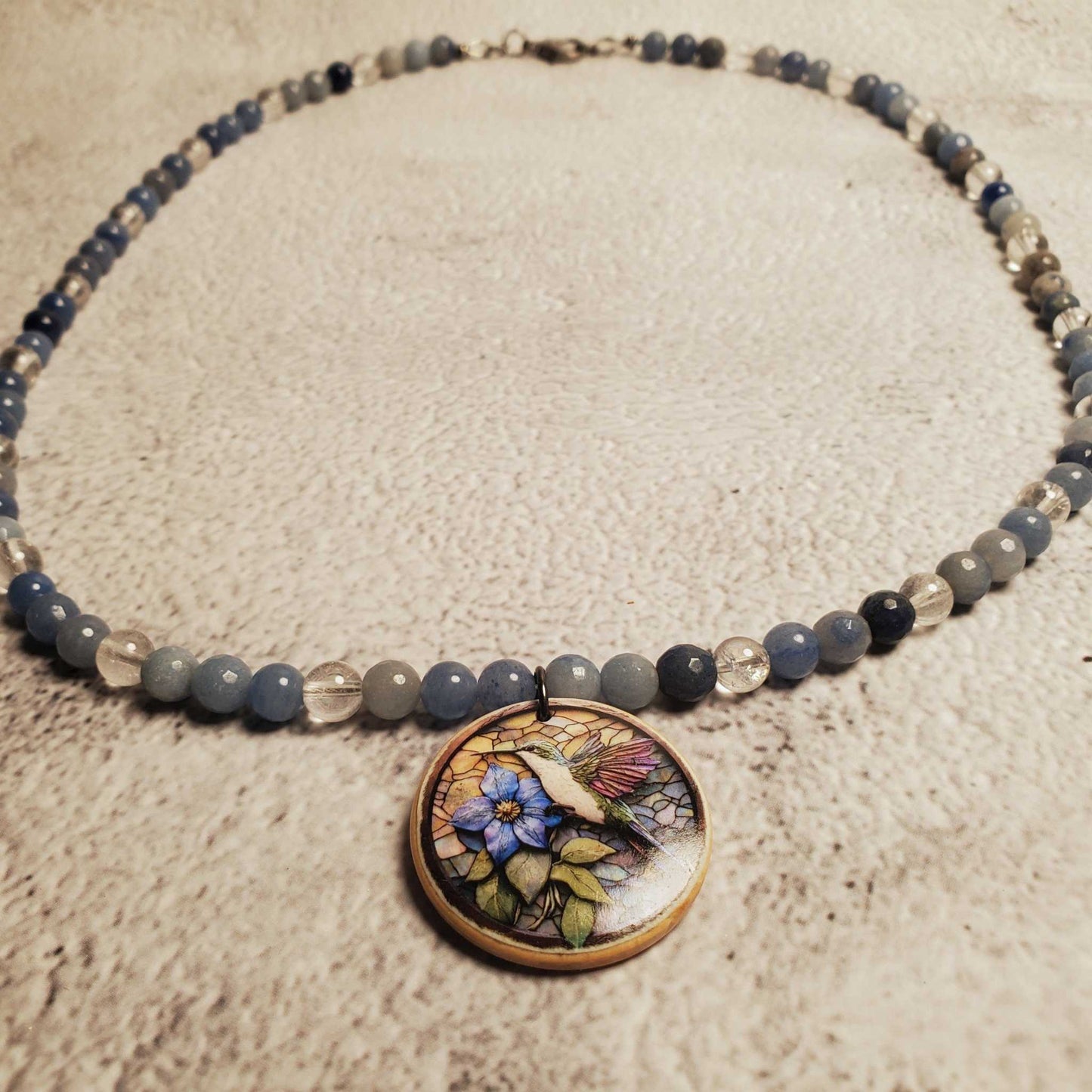 Handcrafted Blue Aventurine and Clear Quartz gemstone necklace with hand-painted floral wood pendant and lobster clasp
