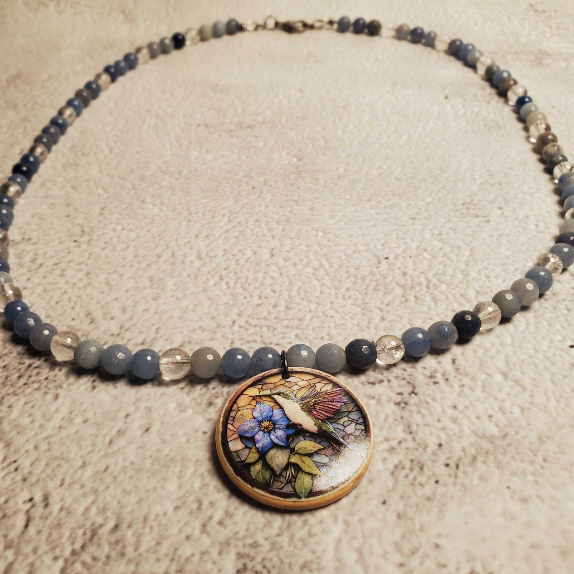 Handcrafted Blue Aventurine and Clear Quartz gemstone necklace with hand-painted floral wood pendant and lobster clasp