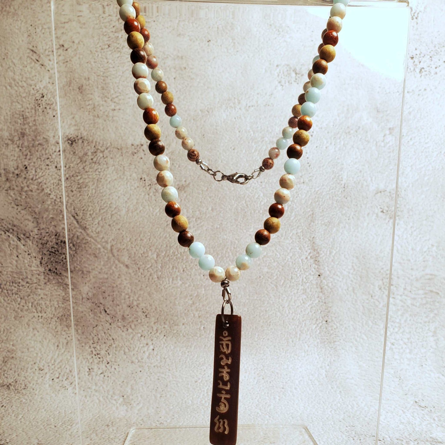 Gemstone necklace with Aquaterra Impression Jasper beads and hand-carved wood Tibetan prayer pendant