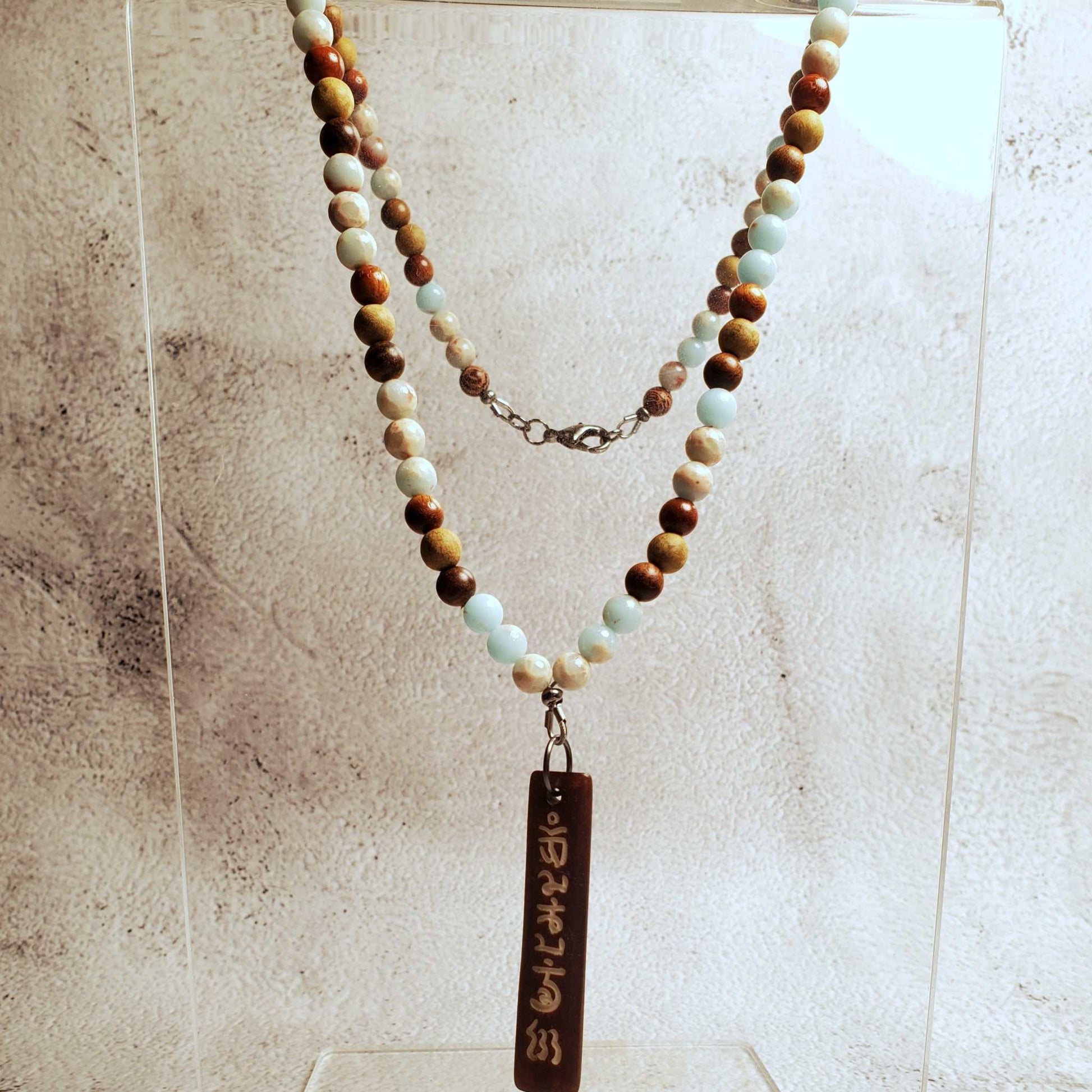 Gemstone necklace with Aquaterra Impression Jasper beads and hand-carved wood Tibetan prayer pendant