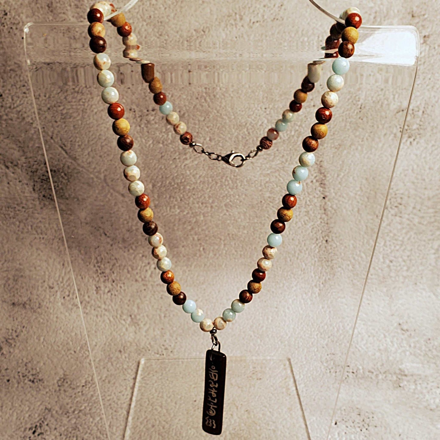 Gemstone necklace with Aquaterra Impression Jasper beads and hand-carved wood Tibetan pendant, 20-inch length with lobster clasp