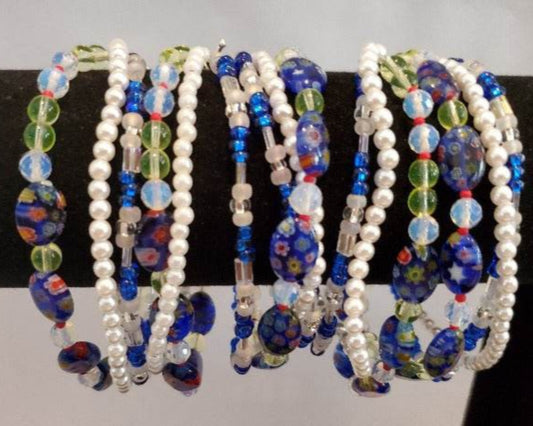 Blue Millefiori and Pearl 3-strand Floral Bracelet with blue floral beads and white acrylic pearls.