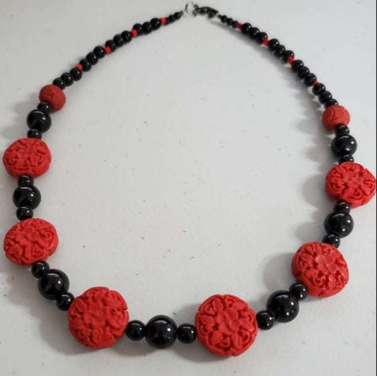 Black and red floral Vintage Fashion necklace with red clay and black glass beads.