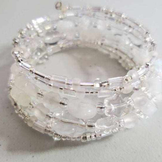 Ice Crystal cuff bracelet with frosty glass and shimmering crystal beads, adjustable open design for versatile fit.